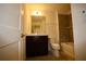 Bathroom with dark wood vanity, integrated sink, and combination shower and tub at 1995 Iorio St, St Cloud, FL 34771