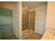 This bathroom includes a glass shower with a tile surround at 1995 Iorio St, St Cloud, FL 34771