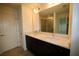 Modern bathroom with double vanity, dark cabinetry, and large mirror at 1995 Iorio St, St Cloud, FL 34771