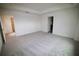 Bright, spacious bedroom with neutral carpet and two entryways at 1995 Iorio St, St Cloud, FL 34771