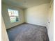 Bright bedroom with neutral carpet, big windows and freshly painted walls at 1995 Iorio St, St Cloud, FL 34771