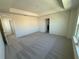 Spacious bedroom featuring neutral carpeting and ample natural light from the window at 1995 Iorio St, St Cloud, FL 34771