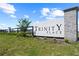 Entrance to the beautiful Trinity Place community with decorative sign and landscaping at 1995 Iorio St, St Cloud, FL 34771