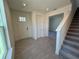 Front foyer with a stairway, half bathroom, and coat closet at 1995 Iorio St, St Cloud, FL 34771