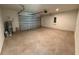 Spacious two-car garage with automatic door, ample room for parking and storage at 1995 Iorio St, St Cloud, FL 34771