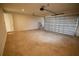 Empty two-car garage with concrete floor and automatic door at 1995 Iorio St, St Cloud, FL 34771