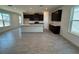 Kitchen and dining area features a center island, dark cabinets, and tile flooring at 1995 Iorio St, St Cloud, FL 34771