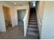 Carpeted staircase near a bathroom and living area at 1995 Iorio St, St Cloud, FL 34771