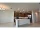 Spacious kitchen with stainless steel appliances, white countertops, and a central island at 1996 Heart Lake Dr, Groveland, FL 34736
