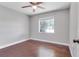 Bedroom with ceiling fan and window with view at 2102 Nedra Ave, Deltona, FL 32725