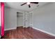 Bedroom featuring ceiling fan, closet, and neutral color palette at 2102 Nedra Ave, Deltona, FL 32725