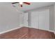 Neutral bedroom featuring a ceiling fan, closet, and en suite bathroom at 2102 Nedra Ave, Deltona, FL 32725