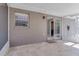 Screened-in patio featuring an outdoor shower and a sliding glass door at 2102 Nedra Ave, Deltona, FL 32725
