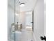 Bathroom featuring a glass shower enclosure and modern vanity with stylish fixtures at 211 E Muriel St, Orlando, FL 32806