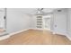 Bedroom with a ceiling fan and sliding door leading to a walk-in closet with shelving at 211 E Muriel St, Orlando, FL 32806