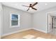 Bedroom with a ceiling fan, window and hardwood floors at 211 E Muriel St, Orlando, FL 32806