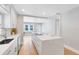Modern kitchen featuring a large island, stainless steel appliances and an open floor plan at 211 E Muriel St, Orlando, FL 32806