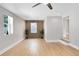 Bright living room with a modern accent wall and large windows for natural light at 211 E Muriel St, Orlando, FL 32806