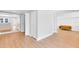 View of the living room showcasing the hardwood floors and open floor plan of this home at 211 E Muriel St, Orlando, FL 32806