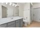 Well-lit bathroom with a single sink vanity, toilet, and shower/tub combination at 2523 Water Valley Dr, St Cloud, FL 34771