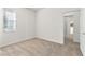 Neutral bedroom featuring carpeted flooring, a window with blinds, and a doorway to a closet at 2523 Water Valley Dr, St Cloud, FL 34771
