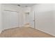 Bedroom featuring carpeted floors, closet, and doorway at 2523 Water Valley Dr, St Cloud, FL 34771