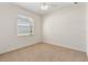 Empty bedroom featuring carpet, window, and ceiling fan at 2523 Water Valley Dr, St Cloud, FL 34771