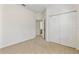 Bedroom with double closet and doorway to another room at 2523 Water Valley Dr, St Cloud, FL 34771