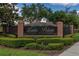 Entrance sign for Lake Pointe at Toho neighborhood surrounded by manicured landscaping and decorative brick at 2523 Water Valley Dr, St Cloud, FL 34771