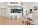 Bright dining area adjacent to kitchen with modern table, chairs, and decorative mirrors at 2523 Water Valley Dr, St Cloud, FL 34771