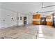 Spacious garage with ample storage cabinets, a water heater, and access to the home at 2523 Water Valley Dr, St Cloud, FL 34771