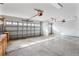 Large three car garage with high ceilings and two garage doors at 2523 Water Valley Dr, St Cloud, FL 34771