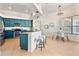 Bright and modern kitchen with blue cabinets, stainless steel appliances, and a cozy breakfast bar at 2523 Water Valley Dr, St Cloud, FL 34771