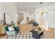 Open-concept living space with tiled floors, a dining area, and a cozy seating area at 2523 Water Valley Dr, St Cloud, FL 34771