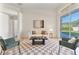 Bright living room with sliding glass doors, a patterned rug, and comfortable seating at 2523 Water Valley Dr, St Cloud, FL 34771