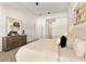 Stylishly decorated main bedroom with neutral decor, wooden dresser, and bright natural light at 2523 Water Valley Dr, St Cloud, FL 34771