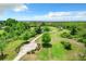 Aerial view of a park with walking path, benches, playground, and scenic waterfront views at 2523 Water Valley Dr, St Cloud, FL 34771