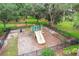 Fenced playground with multiple slides surrounded by lush green spaces at 2523 Water Valley Dr, St Cloud, FL 34771