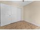 Neutral bedroom featuring tile floors and a large closet with white sliding doors at 2605 S Elm Ave, Sanford, FL 32773