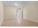 A bright bedroom with neutral paint, tile floors, and an ensuite entrance at 2605 S Elm Ave, Sanford, FL 32773