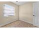 Neutral bedroom with a window with blinds and tile floors at 2605 S Elm Ave, Sanford, FL 32773