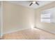 Bedroom with tile flooring, window, and ceiling fan at 2605 S Elm Ave, Sanford, FL 32773