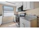 Contemporary kitchen featuring stainless steel appliances and granite countertops at 2605 S Elm Ave, Sanford, FL 32773