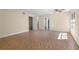 Spacious living room with tile flooring, ceiling fan, and open doorway to other rooms at 2605 S Elm Ave, Sanford, FL 32773
