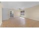 Open-concept living room featuring tile flooring, ceiling fan, and natural light at 2605 S Elm Ave, Sanford, FL 32773