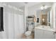 Clean bathroom with a shower/tub combo, white vanity and a mirrored cabinet at 2679 Metro Sevilla Dr # 101, Orlando, FL 32835
