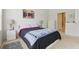 Comfortable bedroom with soft carpet, white walls, and a view to the hallway and bathroom at 2679 Metro Sevilla Dr # 101, Orlando, FL 32835