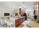 Open kitchen with wood cabinets, granite countertops, breakfast bar seating, and seamless flow to the living areas at 2679 Metro Sevilla Dr # 101, Orlando, FL 32835