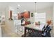 Bright kitchen featuring wood cabinetry, a breakfast bar with seating, and stainless steel appliances at 2679 Metro Sevilla Dr # 101, Orlando, FL 32835