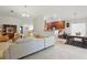 Spacious living room flowing into kitchen and dining areas, perfect for entertaining and modern living at 2679 Metro Sevilla Dr # 101, Orlando, FL 32835